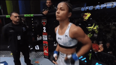 Woman In Boxing Ring With UFC Apex Sign GIF