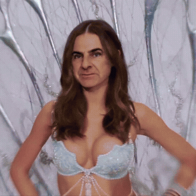 Woman In Bra With Man Behind Her GIF
