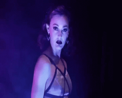 Woman In Bra With Purple Light GIF