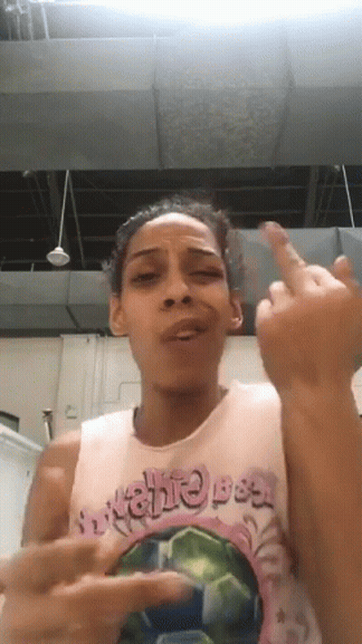 Woman In Breathe Tank Top Giving Middle Finger GIF
