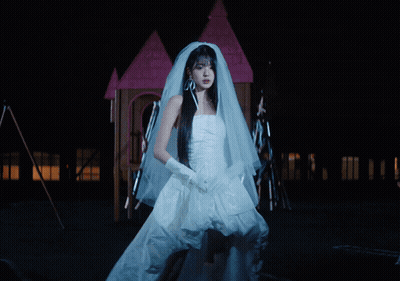 Woman In Bride Dress In Front Of Fire GIF