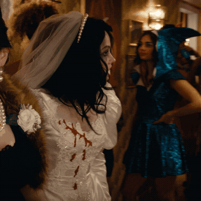 Woman In Bride Dress With Blood On Chest GIF