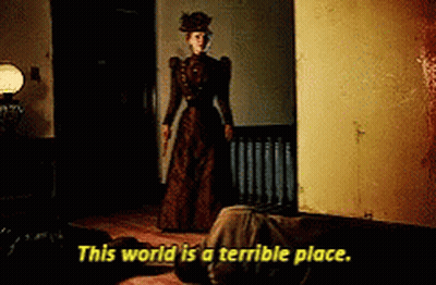 Woman In Brown Dress Holding Knife Saying This World Is A Terrible Place GIF