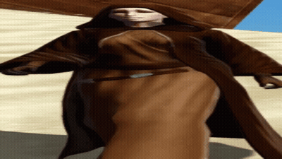 Woman In Brown Hooded Robe In Sand GIF