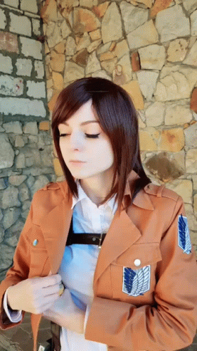 Woman In Brown Jacket With Shoulder Shield GIF
