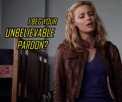 Woman In Brown Leather Jacket In Front Of I Beg Your Unbelievable Pardon Sign GIF