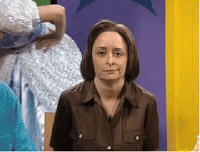 Woman In Brown Shirt Sitting GIF