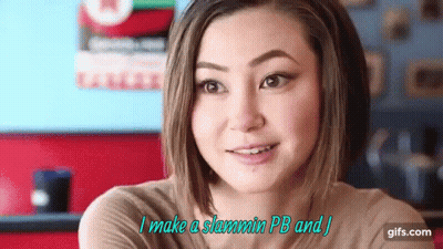Woman In Brown Shirt Smiling Saying I Make A Slammin PB And J GIF