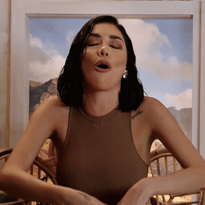Woman In Brown Tank Top With Faith Tattoo GIF