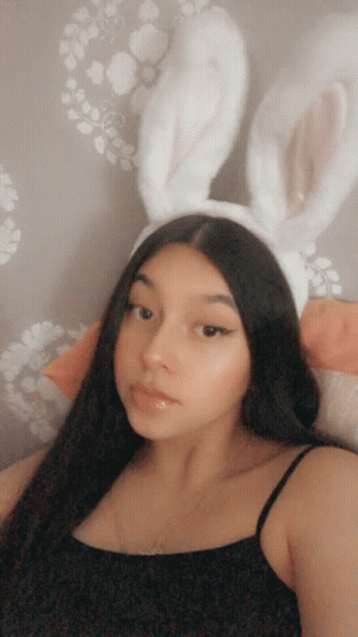 Woman In Bunny Ears And Black Top GIF