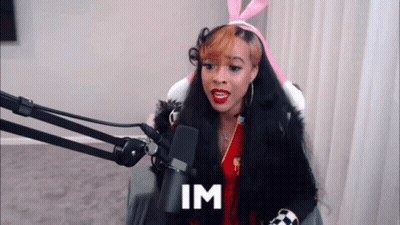 Woman In Bunny Ears At Microphone Saying Im GIF