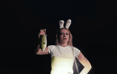 Woman In Bunny Ears Holding Fish GIF