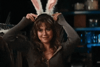Woman In Bunny Ears Smiling GIF