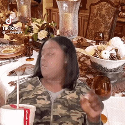 Woman In Camouflage Jacket Holding Chicken Cup GIF