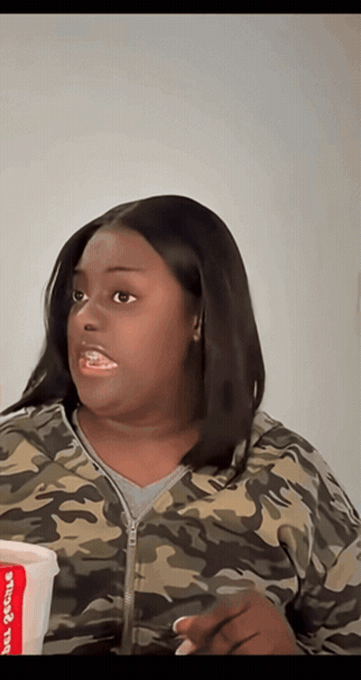 Woman In Camouflage Jacket Holding Chicken Cup GIF