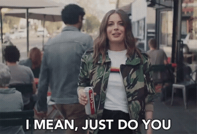 Woman in Camouflage Jacket Holding Coke Saying Do You