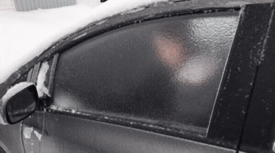 Woman In Camouflage Jacket Lying On Bed GIF
