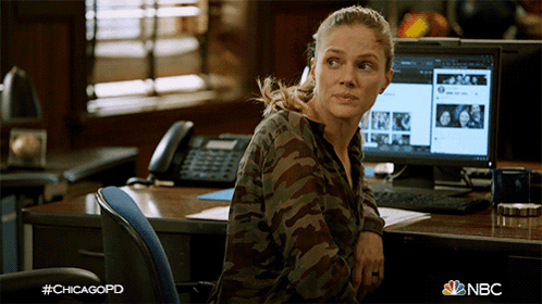 Woman In Camouflage Shirt At Desk With #Chicagopd GIF