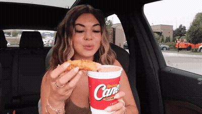 Woman In Car Eating Chicken Nugget Drinking Cane Soda GIF
