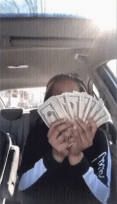 Woman In Car Holding Money GIF