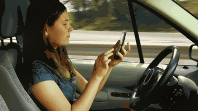 Woman In Car Looking At Cell Phone GIF