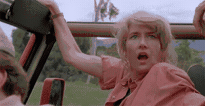 Woman In Car Open Mouth, Man Driving Behind GIF