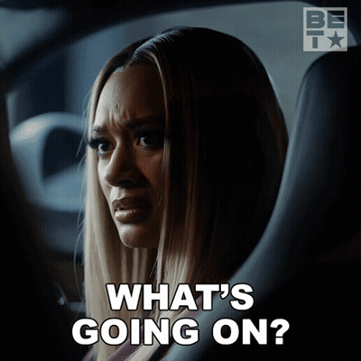 Woman In Car Saying What's Going On GIF