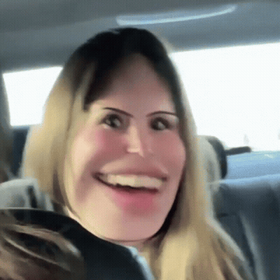Woman In Car Smiling Funny Face GIF