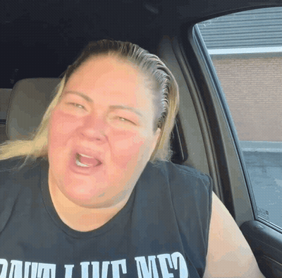 Woman In Car Wearing Damn I Love Me Shirt GIF