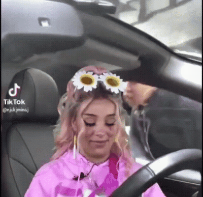 Woman In Car With Flower Headband GIF