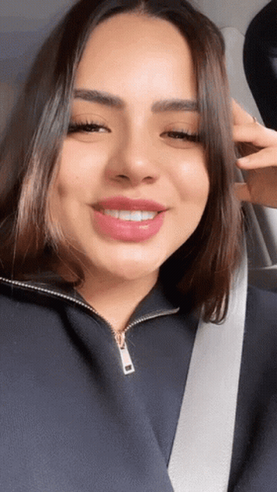 Woman In Car With Seat Belt Around Neck GIF