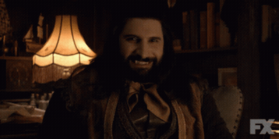 Woman In Cat Costume Holding Knife In Dark Room GIF