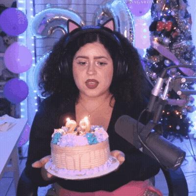 Woman In Cat Ear Headband Holding Birthday Cake GIF