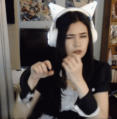 Woman In Cat Ear Headphones Looking At Camera GIF