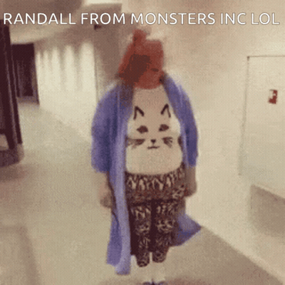Woman In Cat Sweater Walking Down Hallway Saying Randall From Monsters Inc LOL GIF