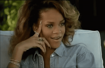 Woman In Chair Hand On Forehead Smiling GIF