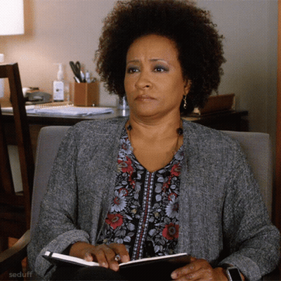 Woman In Chair Holding Notebook Seduff GIF