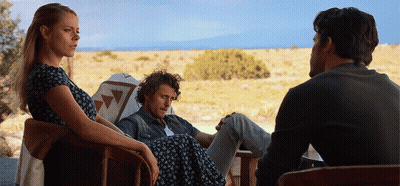 Woman In Chair Next To Two Men GIF