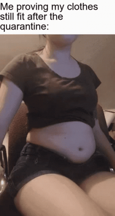 Woman In Chair Proving My Clothes Still Fit GIF