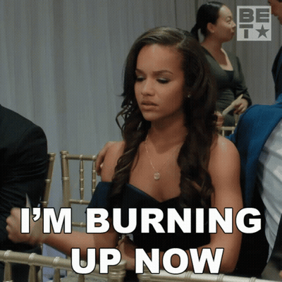 Woman In Chair Saying I'm Burning Up Now GIF