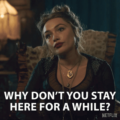 Woman in Chair Saying Why Don't You Stay Here for a While