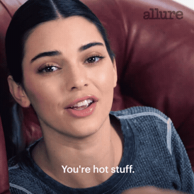 Woman In Chair Saying You're Hot Stuff GIF