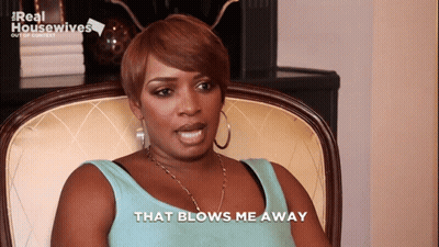 Woman In Chair That Blows Me Away GIF