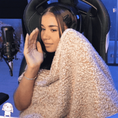 Woman In Chair With Blanket Around Shoulders GIF