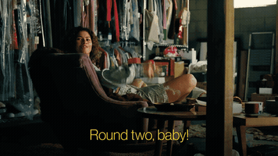 Woman In Chair With Feet Up Round Two Baby GIF