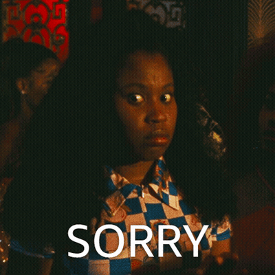 Woman In Checkered Shirt Saying Sorry GIF