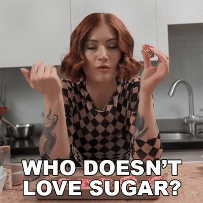 Woman In Checkered Shirt Saying Who Doesn't Love Sugar GIF
