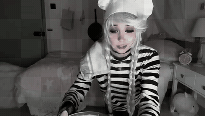 Woman in Chef Costume Sitting With Bowl of Food