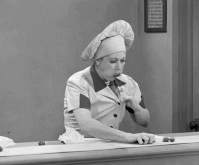 Woman in Chef Hat Eating Food