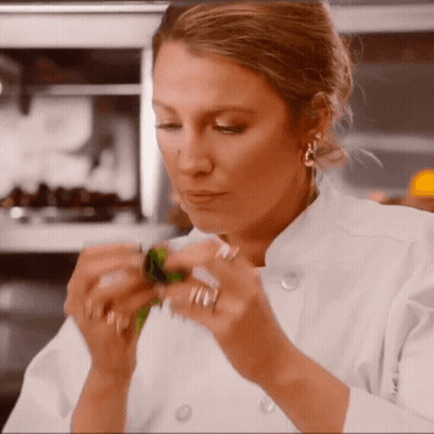 Woman In Chef Uniform Holding Something GIF